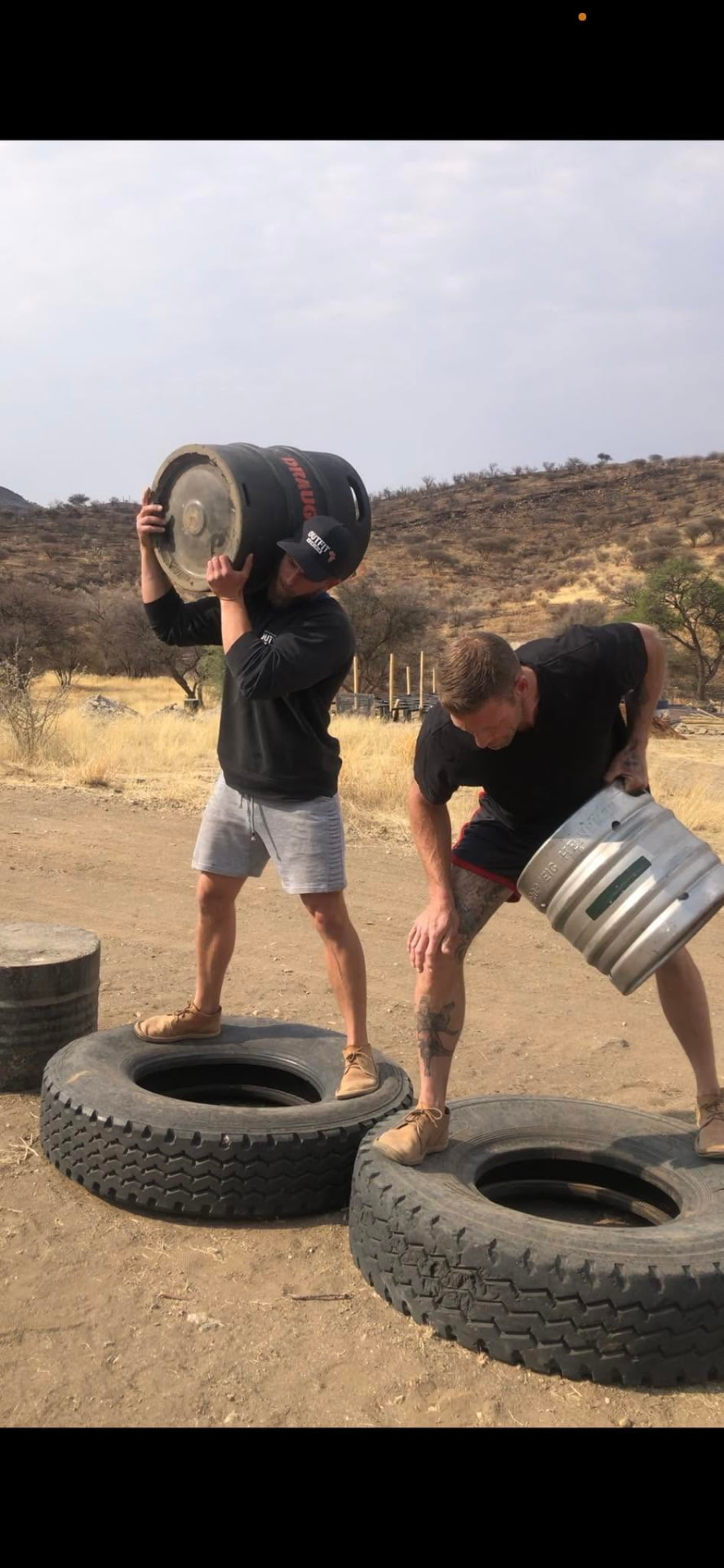 Outdoor strongman training with kegs and tyres at Outfit Namibia