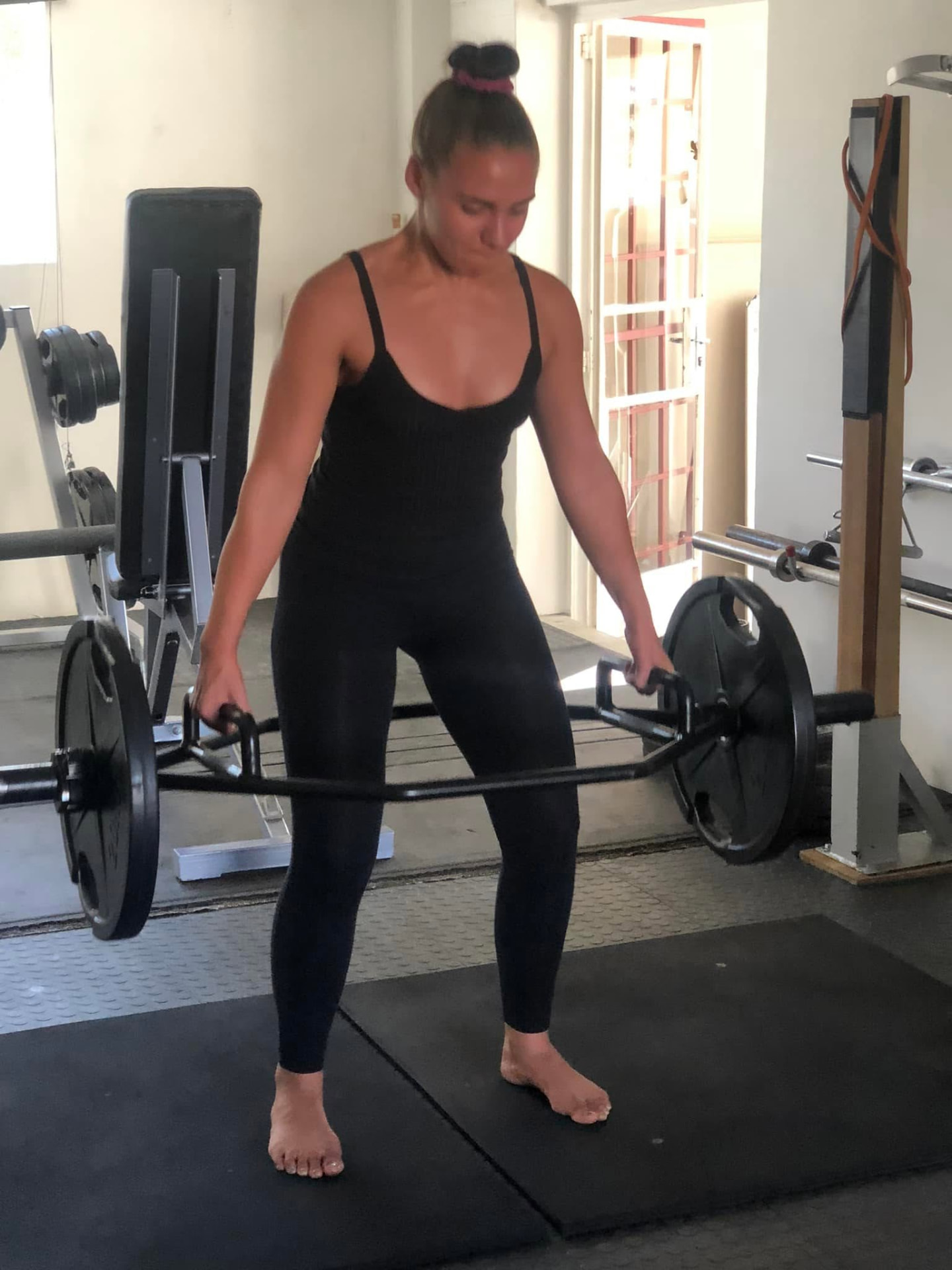 Athlete lifting a trap bar in the Outfit Namibia strength gym