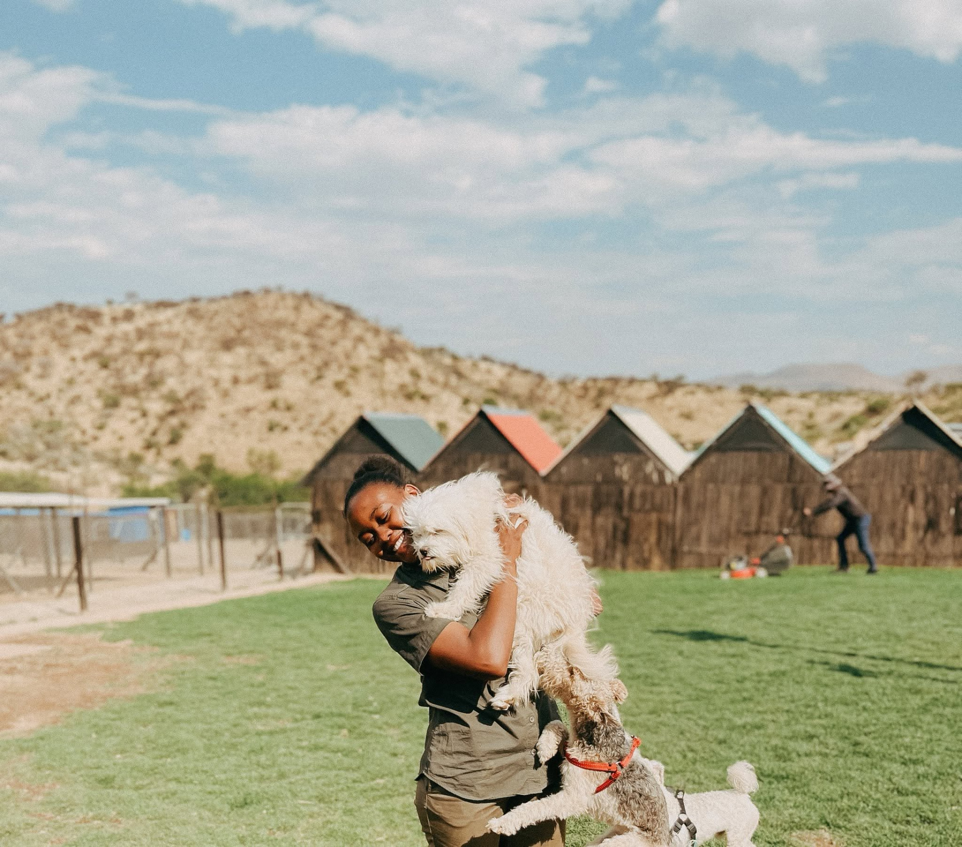 Handler hugging a dog at Barker & Bone