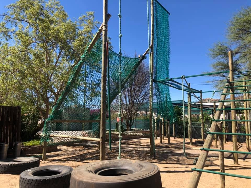 Cargo nets, climbing ropes, monkey bars and tyres on the outdoor obstacle course