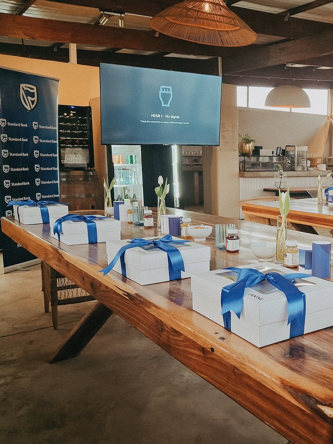 Branded gift boxes and banner set up for a corporate function