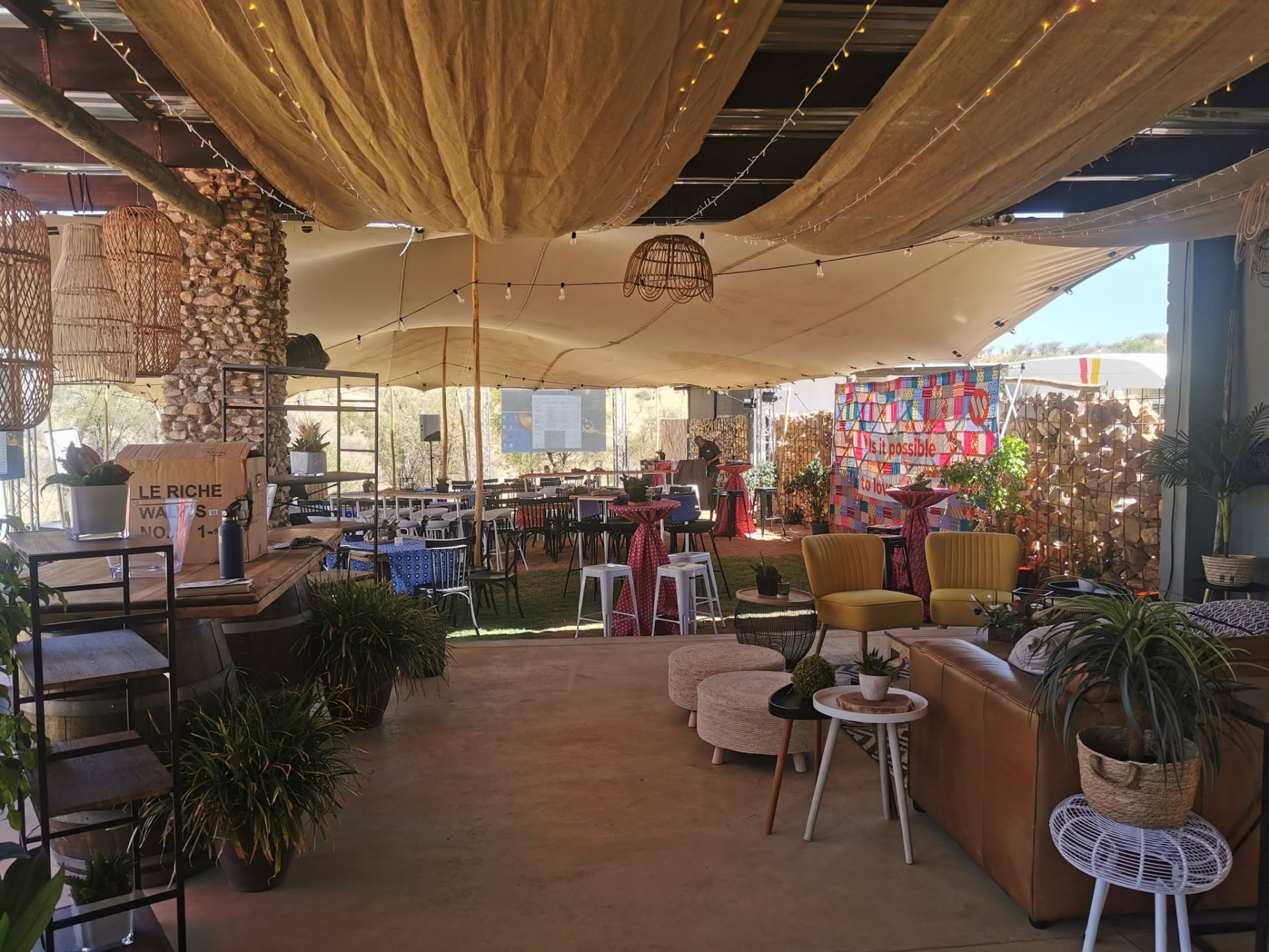 Covered stoep lounge and bar with stretch tents and festoon lights