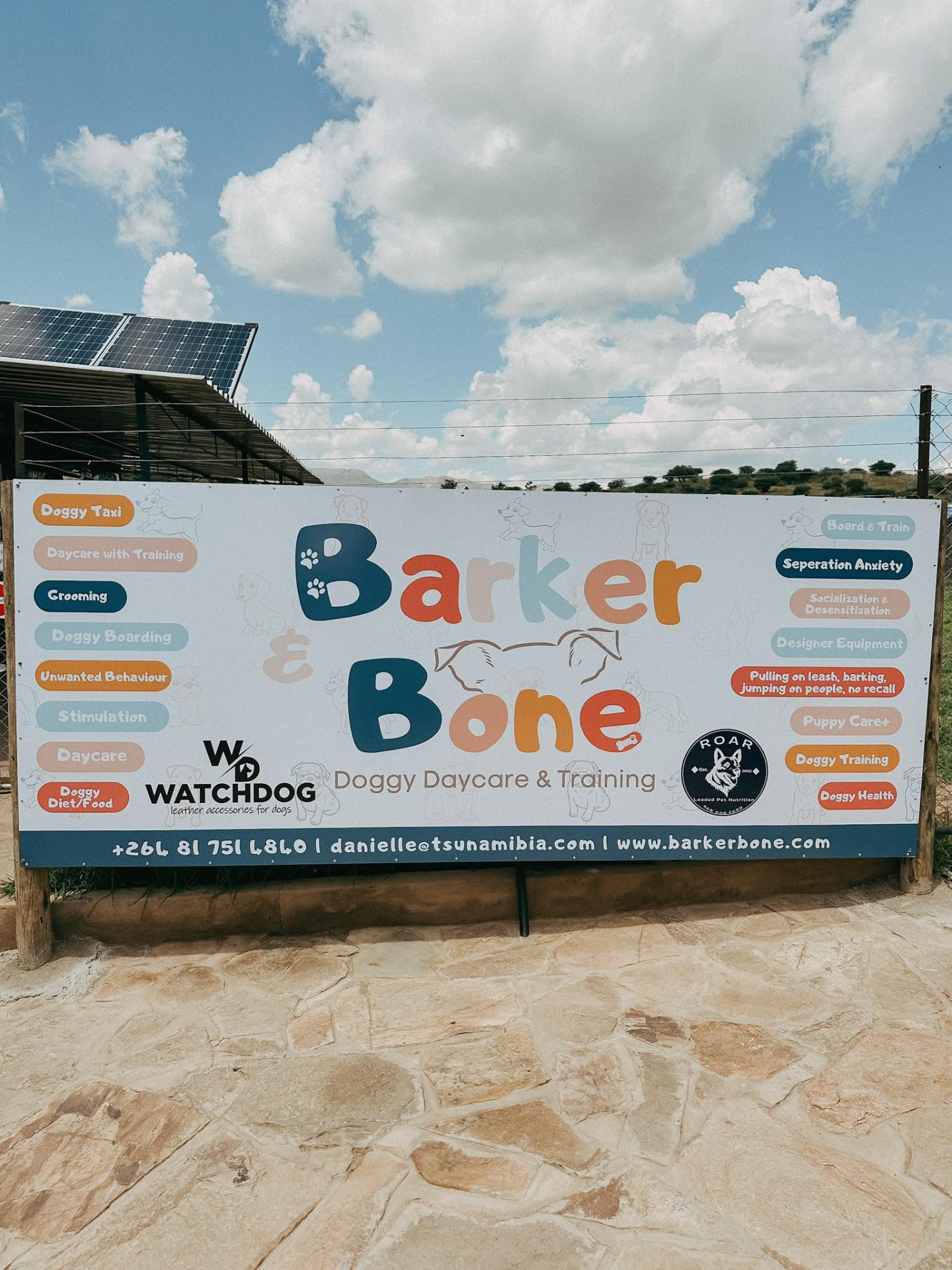 Barker & Bone signboard listing all daycare and training services